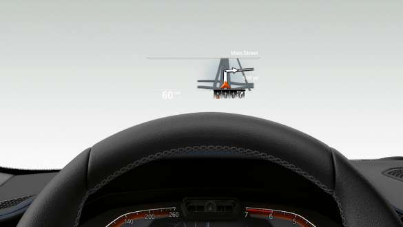BMW Head-Up Display i BMW 3-serie Sedan. Nærbilde av halve rattet og frontruten til BMW 3-serie Sedan med BMW Head-Up Display sett forfra.