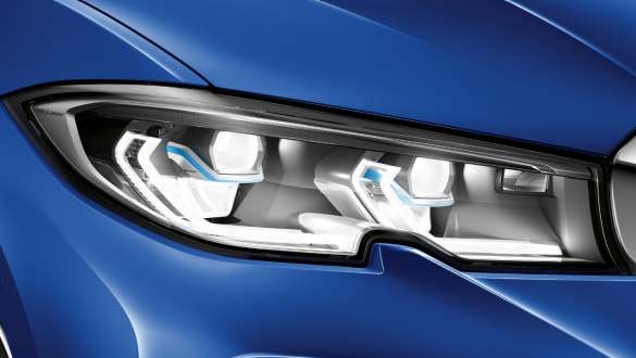 BMW 3-serie Sedan med BMW laserlys. Nærbilde av venstre hovedlykt med BMW laserlys sett fra siden.