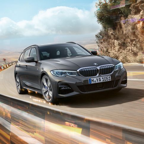 BMW 3-serie Touring, design sett på skrått forfra BMW 3-serie Touring, sett på skrått forfra på vei over bro i landlige omgivelser