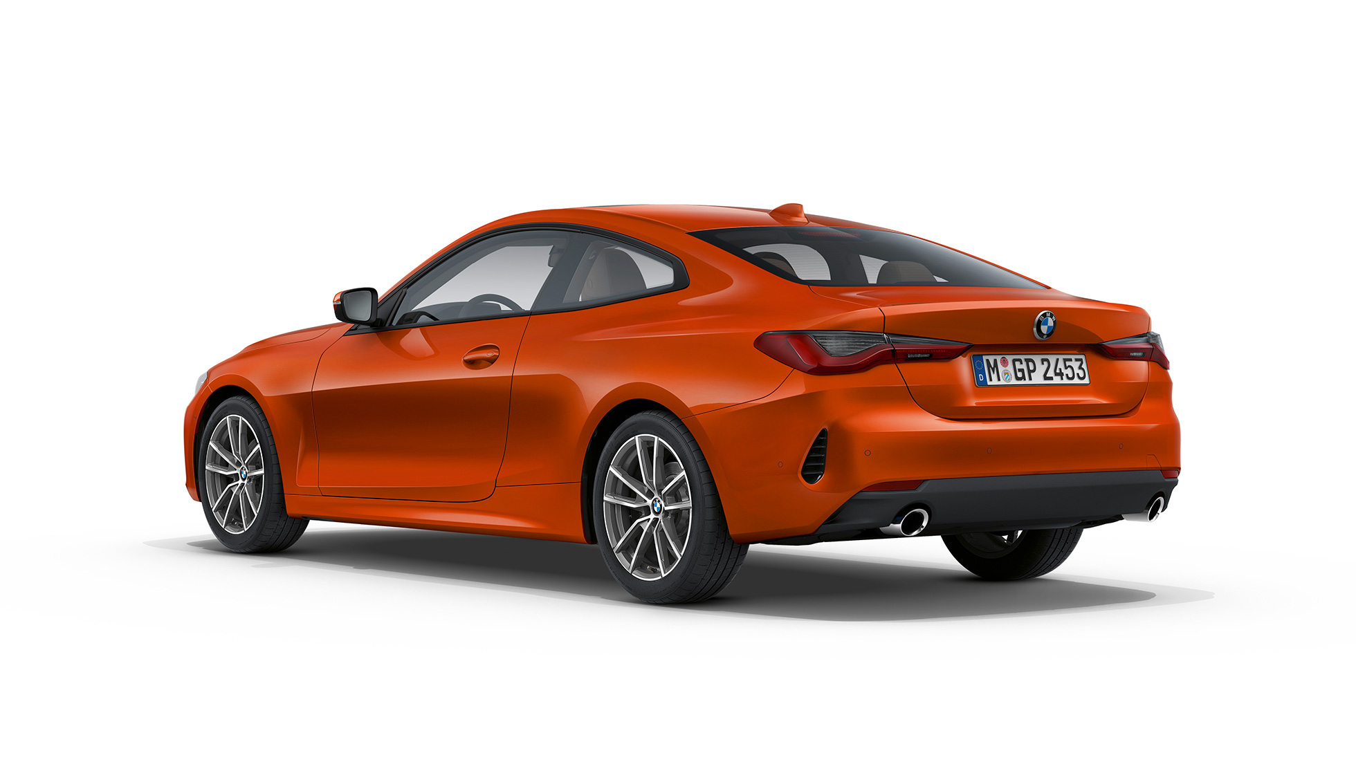 Sett skrått bakfra BMW 4-serie Coupé Standardversjon G22 2020 BMW 4-serie Coupé G22 2020 Standardversjon Sunset Orange metallic Sett skrått bakfra
