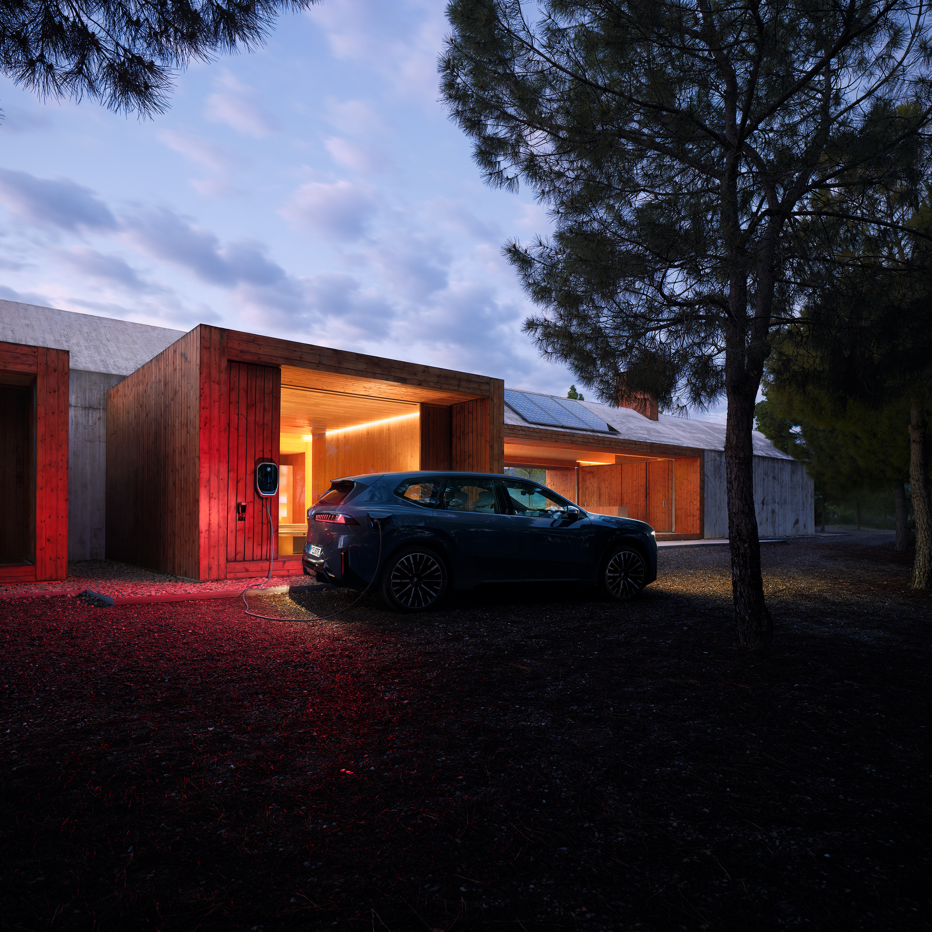 En BMW iX3 er koblet til en Wallbox om natten